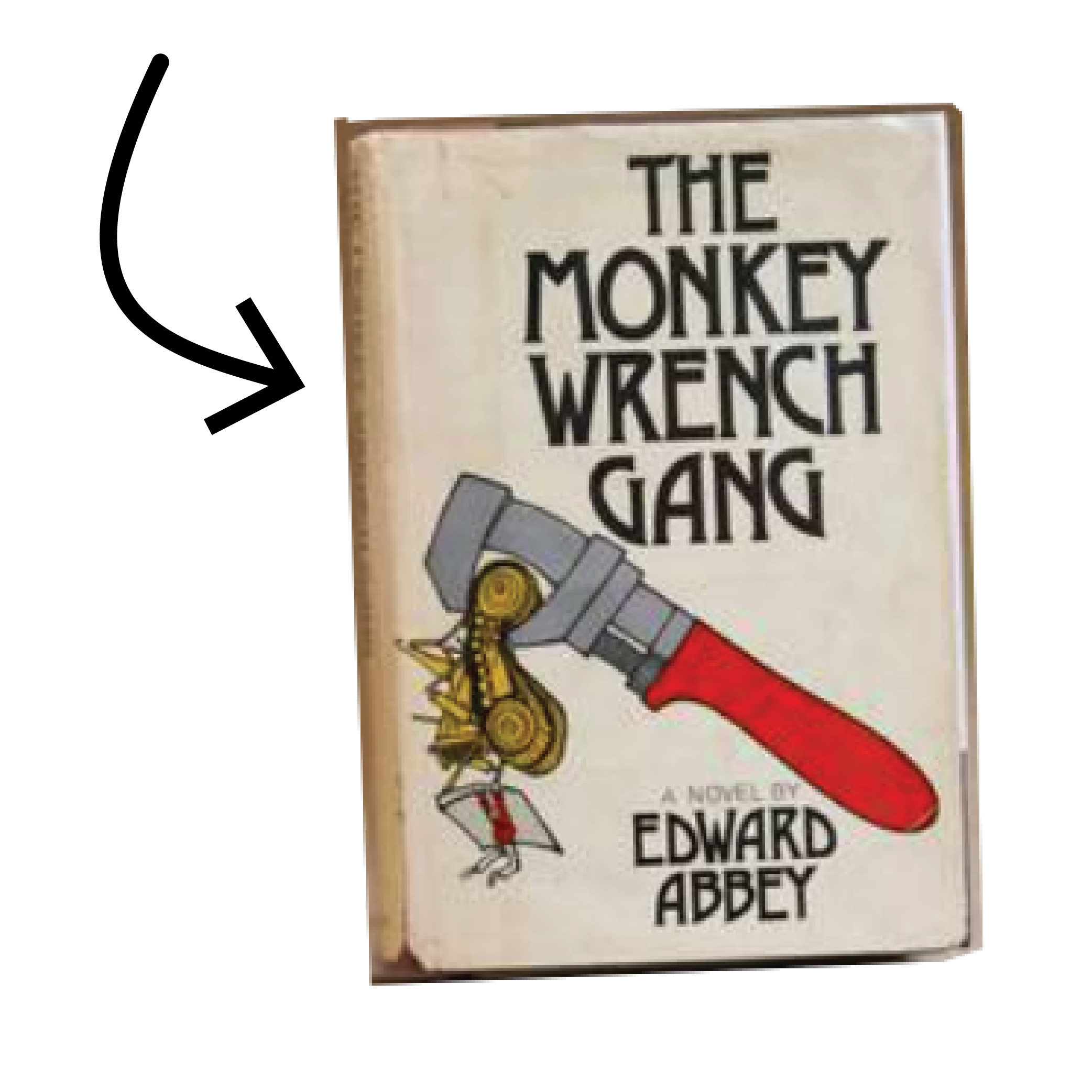 An arrow points to a vintage copy of The Monkey Wrench Gang